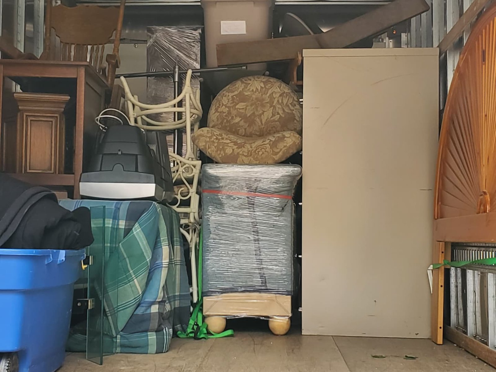 A moving truck carefully loaded with wrapped furniture and labeled boxes
